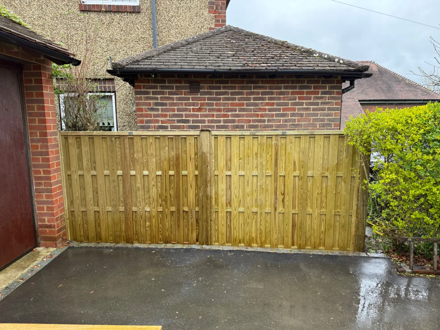 Tongue and groove timber driveway gates installed