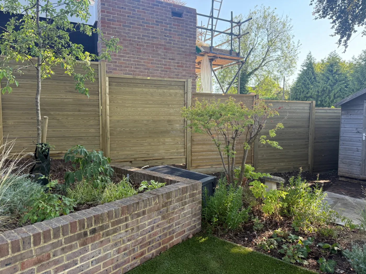 Modern horizontal panel garden fencing completed