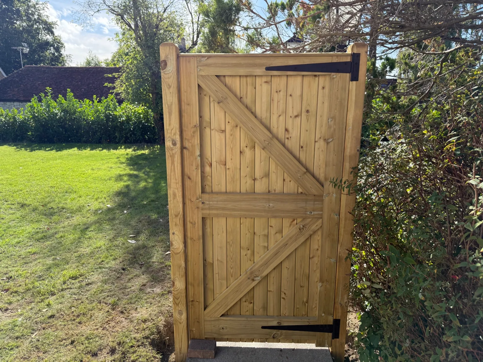 Braced timber garden gate hung on posts garden